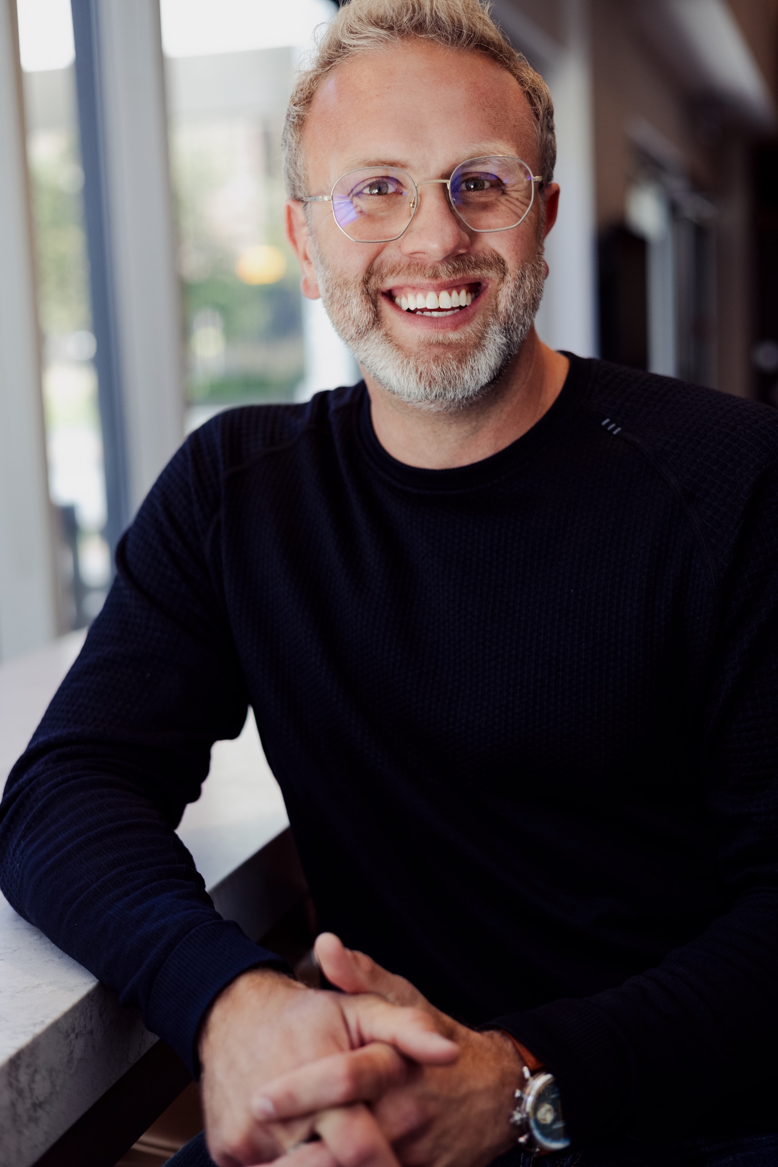 Alex Putici smiling indoors